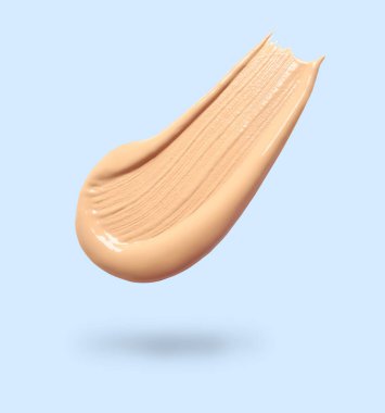 Açık mavi arkaplandaki deri temeli. Kozmetik ürünü