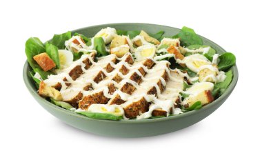 Lezzetli Sezar salatası ve beyaz tenceredeki tavuk.