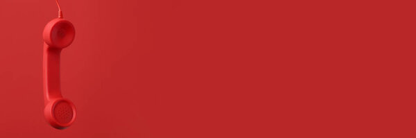 Red corded telephone handset on red background. Banner design with space for text
