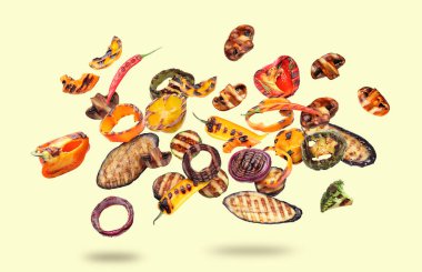 Açık sarı arka planda havada lezzetli ızgara sebzeler.