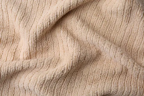 Arka plan olarak temiz bej mikrofiber kumaş, üst görünüm