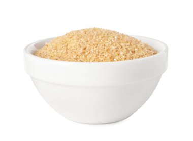 Beyaz kasede çiğ buğday inliyor.