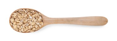 Tahta kaşıkta kuru yulaf ezmesi. Beyaz, üst manzara.