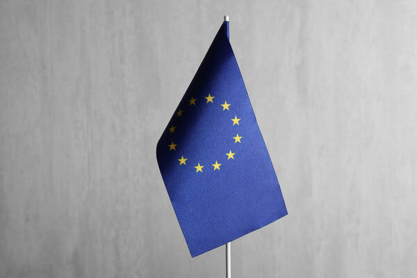 One flag of European Union on grey textured background