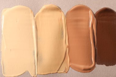 Bej arkaplan ve üst görünümde farklı temellerin örnekleri