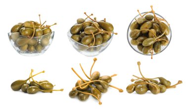 Lezzetli turşulu kapari üzümleri beyaz sette izole edilmiş.