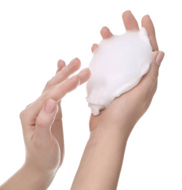 Woman with cleansing foam on hands against white background, closeup