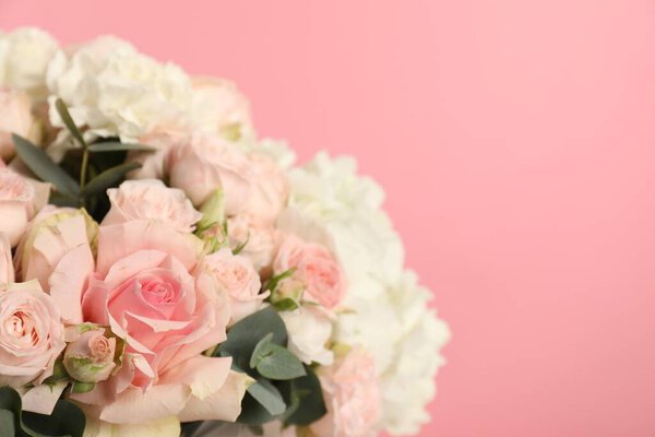 Beautiful bouquet on pink background, closeup. Space for text