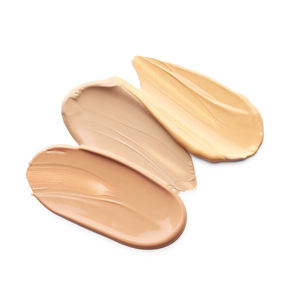 Skin foundation isolated on white, top view. Samples of cosmetic product