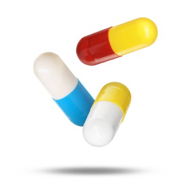 Beyaz arka planda havadaki antibiyotik hapları