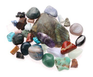 Pile of different natural mineral stones isolated on white, top view clipart