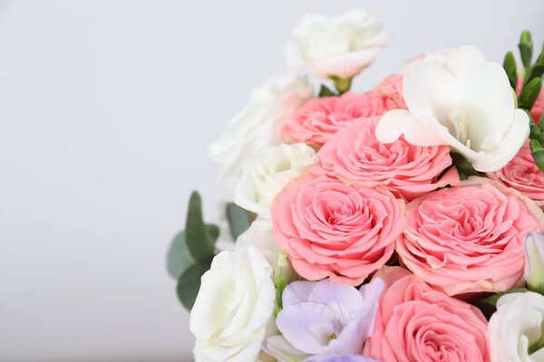 Beautiful wedding bouquet on light background, closeup. Space for text