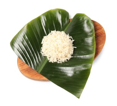 Cut banana leaf with pile of rice isolated on white, top view. Healthy eco serving