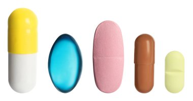 Sıraya dizilmiş farklı haplar beyaz, set