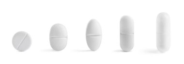 Sıraya dizilmiş farklı haplar beyaz, set