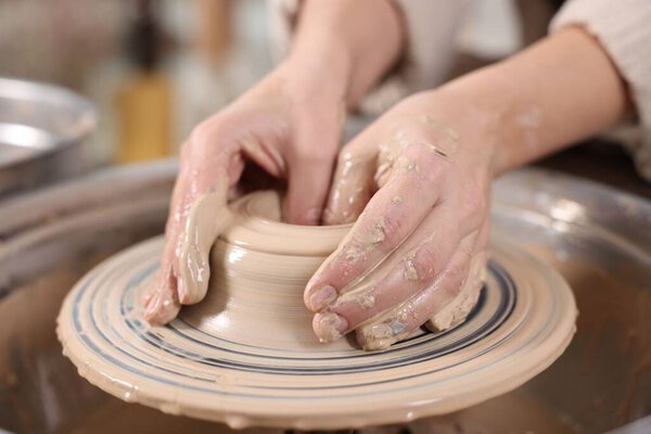 Hobby and craft. Woman making pottery indoors, closeup