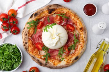 Delicious pizza with burrata cheese served on light grey table, top view clipart