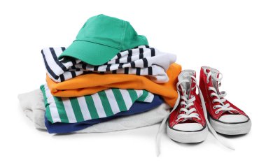 Different used clothes and shoes isolated on white clipart