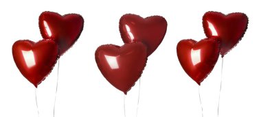 Parlak kırmızı kalp şeklindeki balonlar beyazın üzerinde izole edilmiş.
