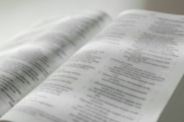 Open Holy Bible in English language, closeup clipart