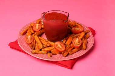 Tasty ketchup, tomatoes and fried carrots on pink background clipart