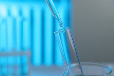 Bulanık arkaplanda test tüpüne sıvı damlatılıyor. Yakın plan.