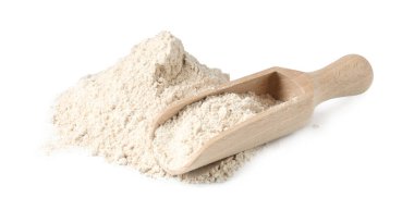 Pile of brown rice flour and scoop isolated on white