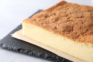 Tasty Japanese Castella sponge cake on light table, closeup