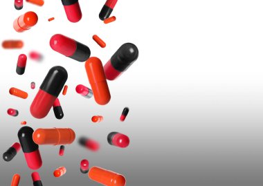 Gri gradyan arkaplanda uçuşan birçok farklı hap, metin için boşluk