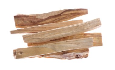 Pile of palo santo sticks in air on white background, top view