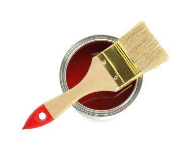 Can of red paint and brush isolated on white, top view