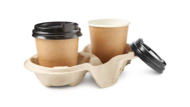 Paper coffee cups in cardboard holder isolated on white