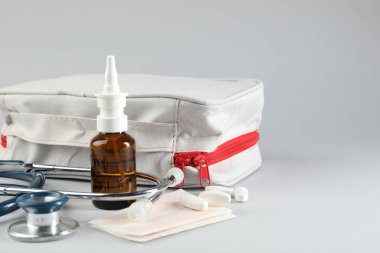 First aid kit. Different medical supplies on light grey background, closeup. Space for text