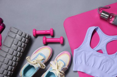 Different gym stuff on grey background, flat lay