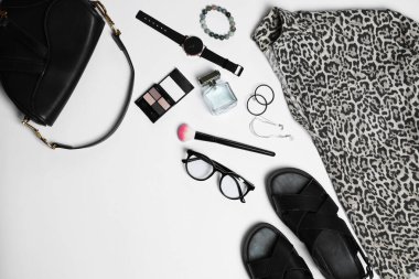 Stylish women's clothes and different accessories on white background, flat lay. Space for text