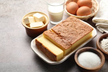 Tasty Japanese Castella sponge cake and ingredients on light table