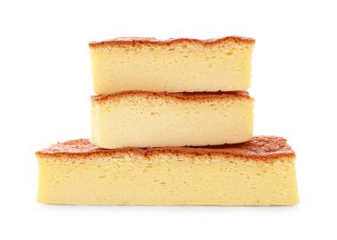 Pieces of tasty Japanese Castella sponge cake isolated on white
