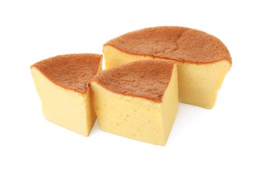 Pieces of tasty Japanese Castella sponge cake isolated on white