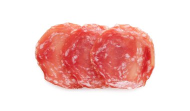 Slices of tasty smoked sausage on white background, top view