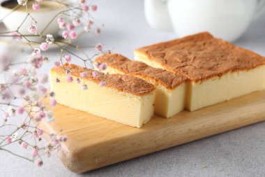 Tasty Japanese Castella sponge cake served on light table, closeup