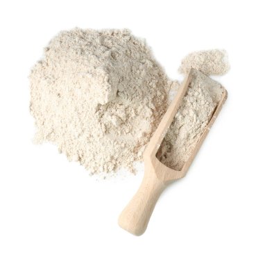 Pile of brown rice flour and scoop isolated on white, top view