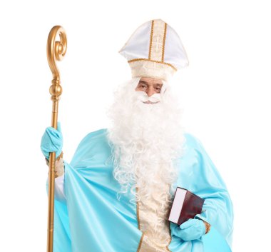 Aziz Nicholas 'ın beyaz arka planda kitabı ve crozier' ı var.