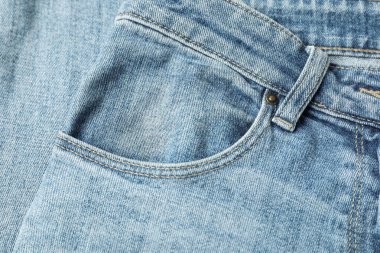 Arka plan olarak cep, üst görünüm şık açık mavi kot