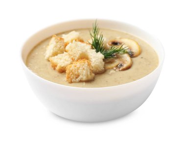 Ekmek arası mantar kremalı çorba ve beyaz arka planda dereotu.