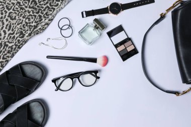 Stylish women's clothes and different accessories on white background, flat lay. Space for text