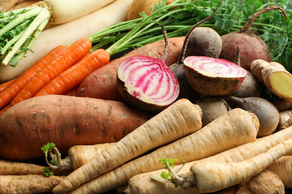 Different raw root vegetables as background, closeup