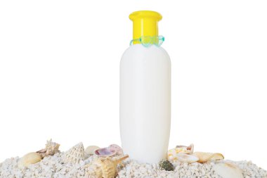 Bottle of sun protection product and seashells on pebbles against white background