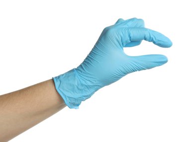 Tıbbi eldivenli doktor beyaz arka planda bir şey tutuyor.