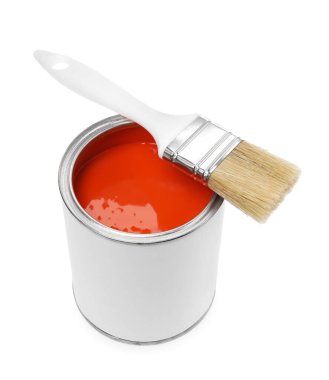 Can of orange paint and brush isolated on white
