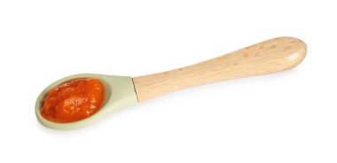 Bebek maması. Beyaz kaşık içinde lezzetli püre.